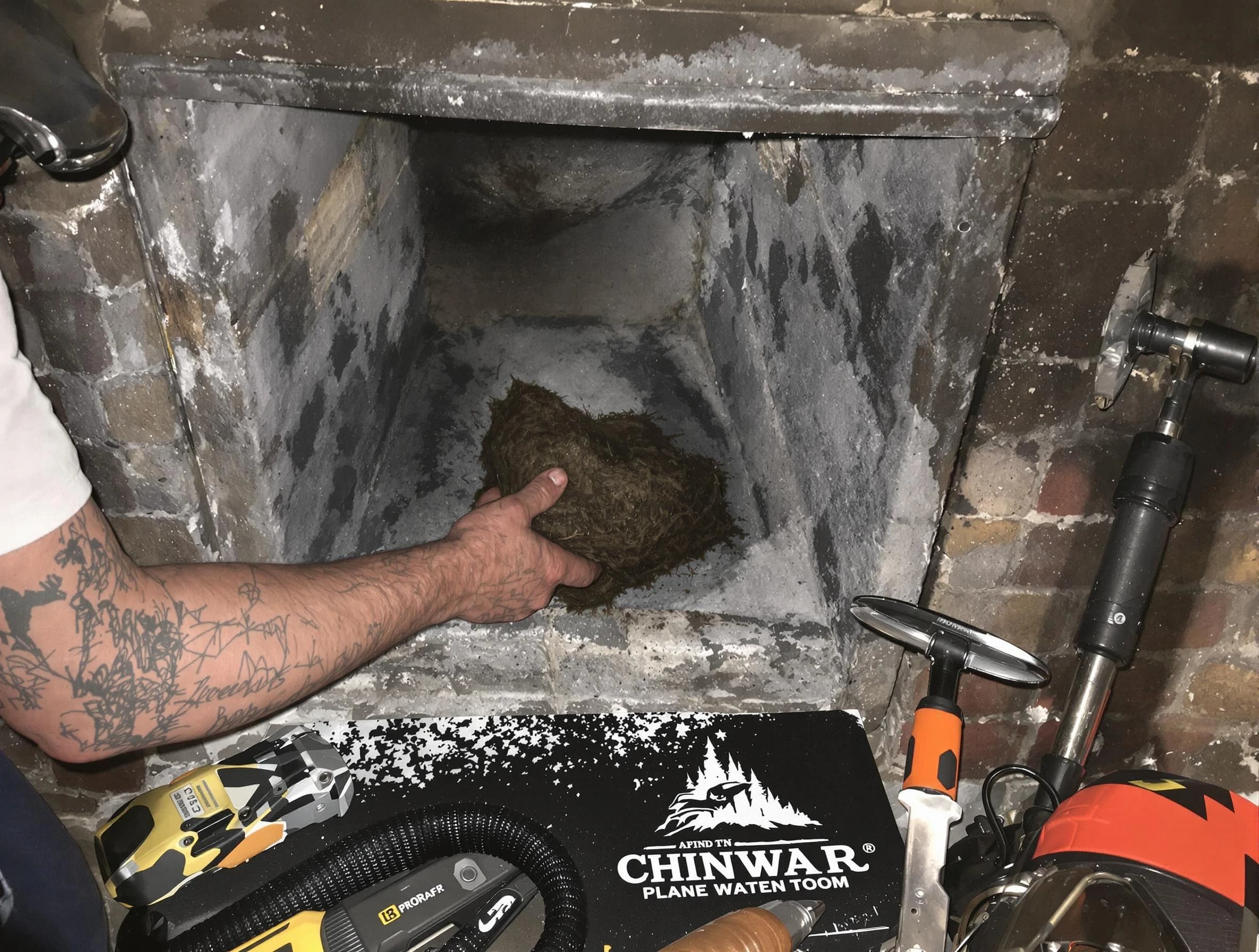 Milton Chimney Sweep safely removing debris and screening chimney in Milton, GA