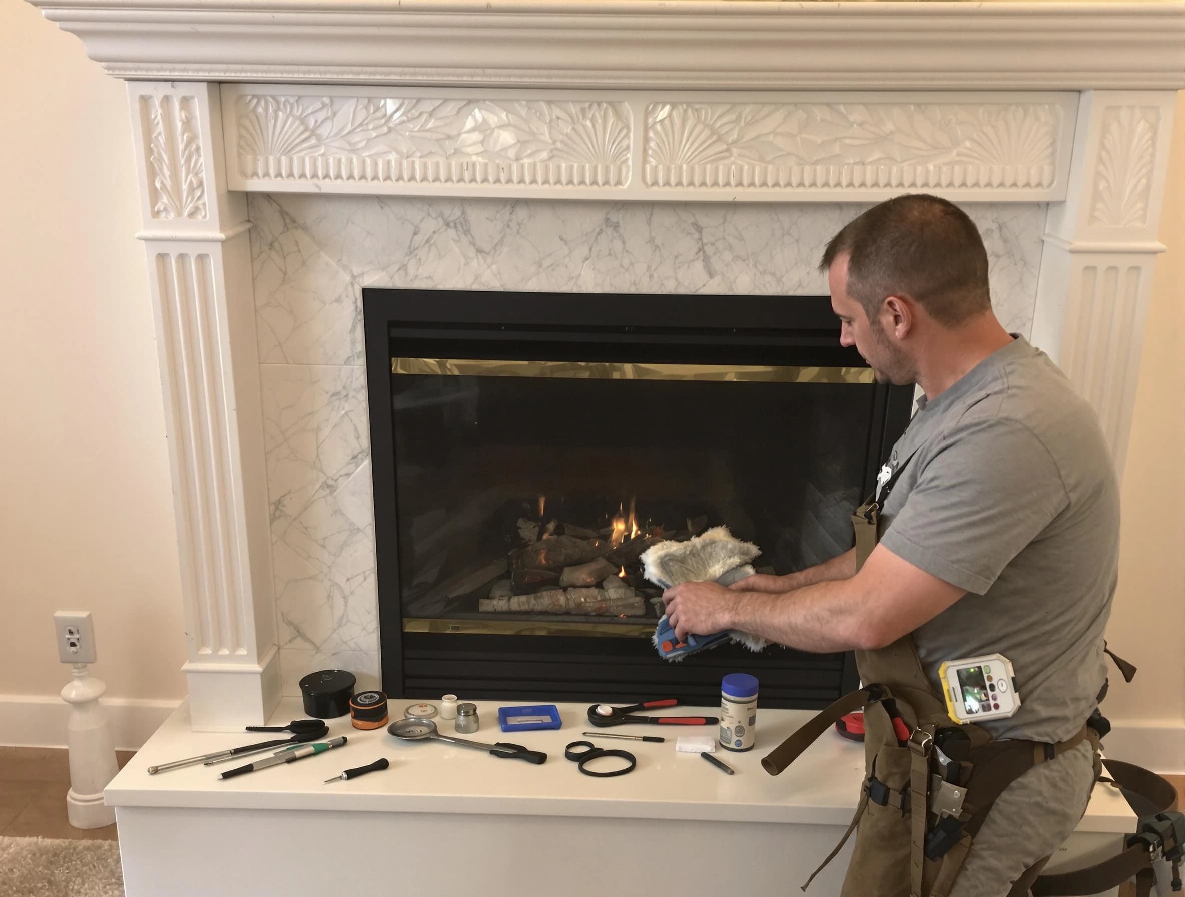 Milton Chimney Sweep performing fireplace maintenance in Milton, GA